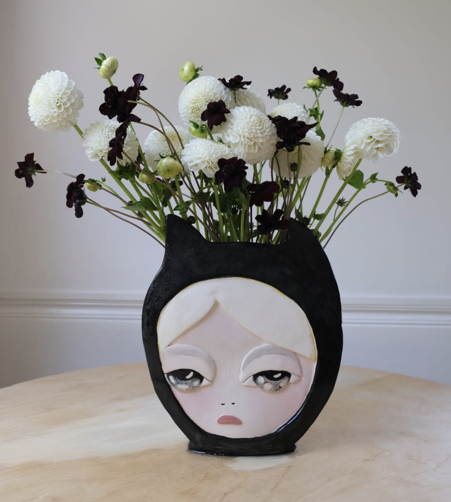 Ceramic cat-face vase with flowers