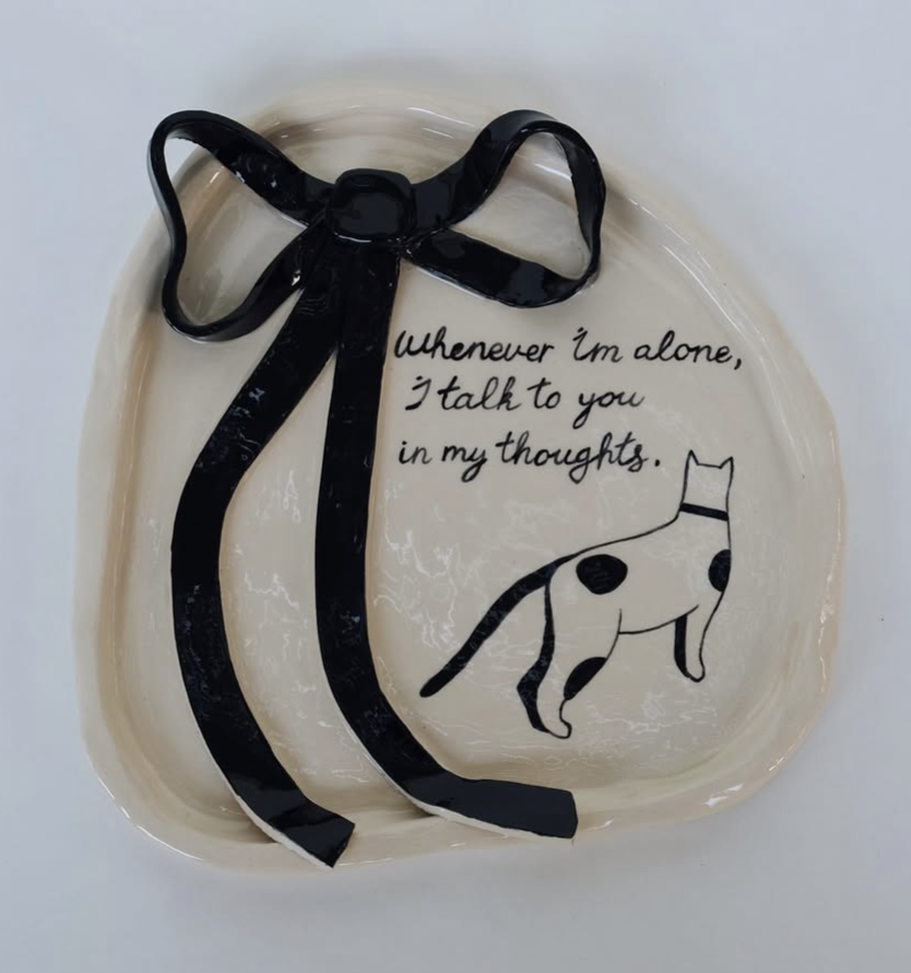 Ceramic tray with black bow and spotted cat drawing