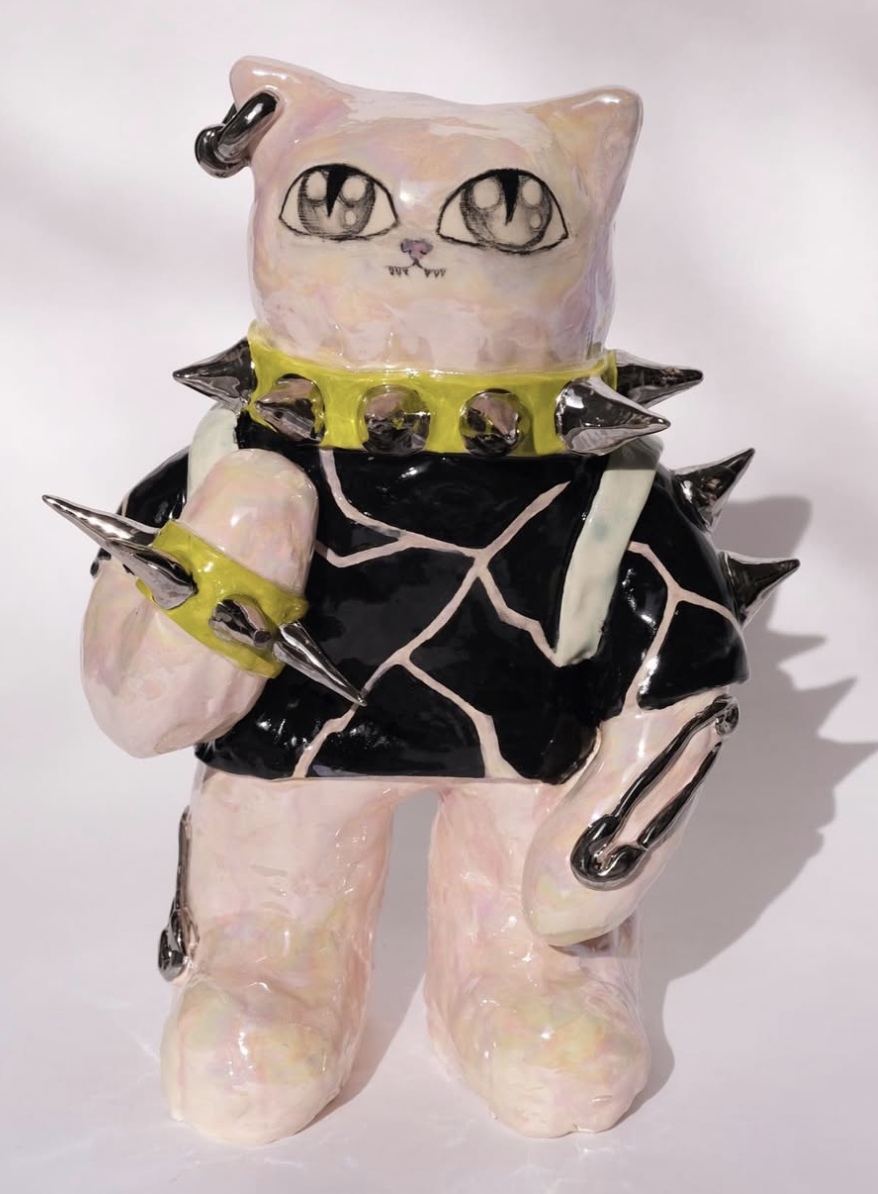Ceramic punk cat figure with spikes and lime collar