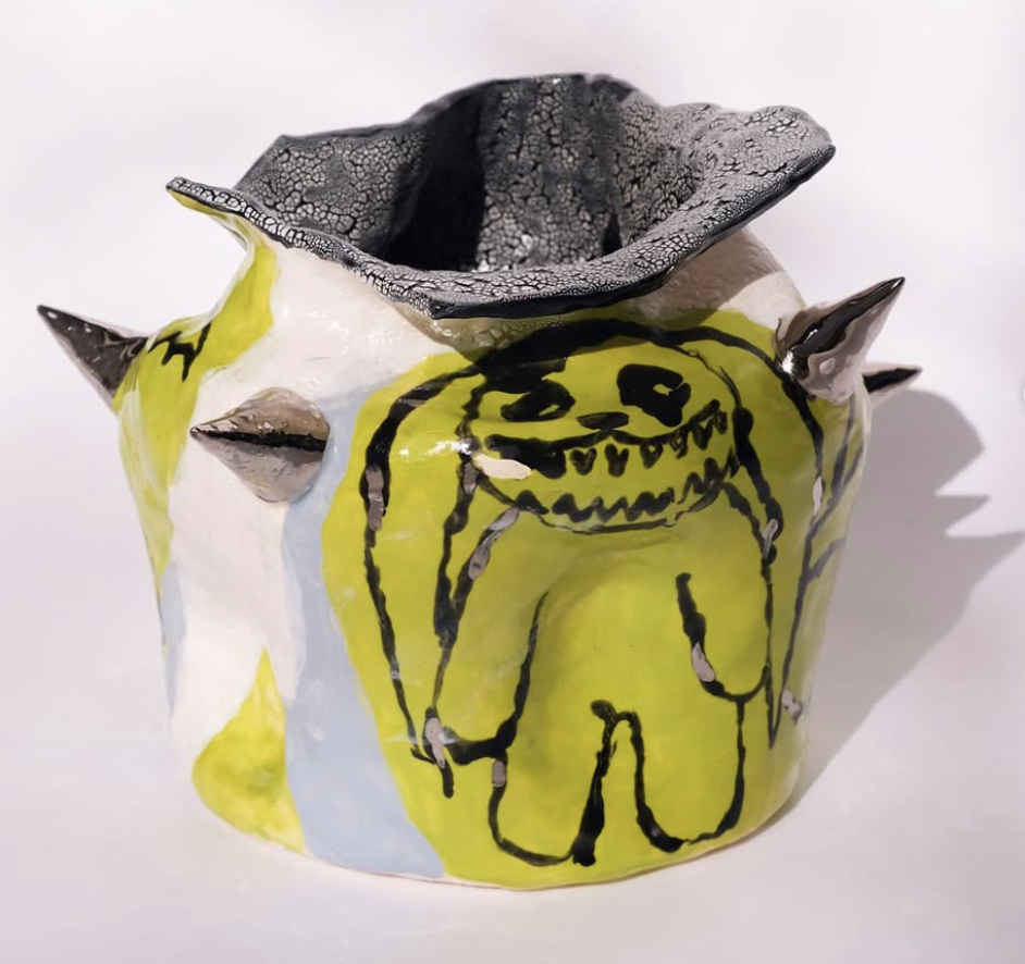 Ceramic spiked vessel with lime dog drawing