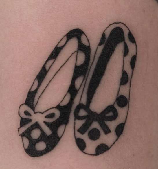 Fine-line tattoo of polka-dot ballet flats with bows