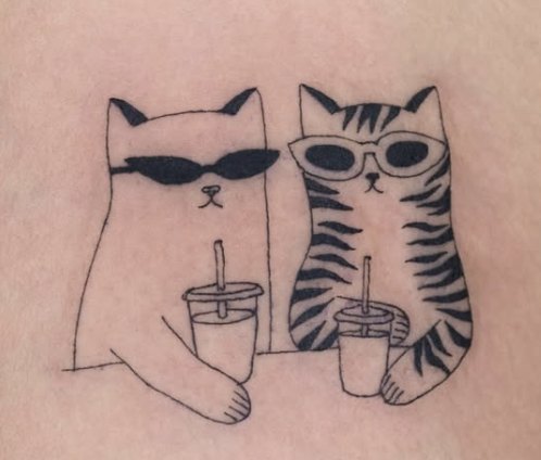 Fine-line tattoo of two cats in sunglasses with iced drinks