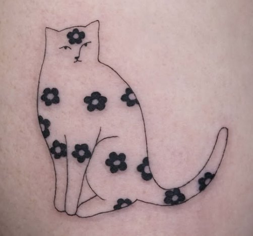 Fine-line tattoo of a cat scattered with small flowers