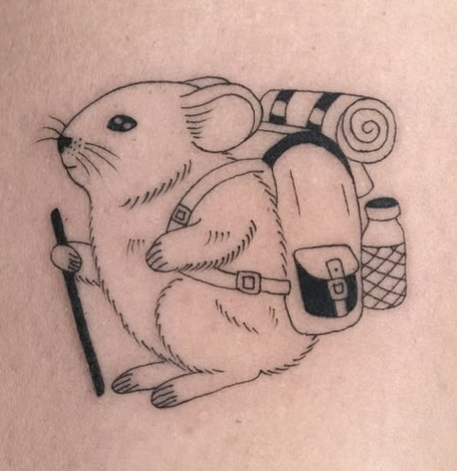 Fine-line tattoo of a mouse with a hiking backpack