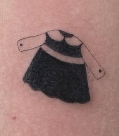 Fine-line tattoo of a little black dress