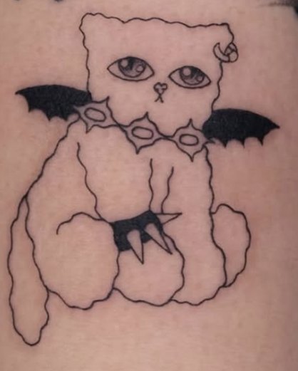 Fine-line tattoo of a bear-cat outline