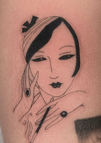 Linework tattoo of a woman holding scissors