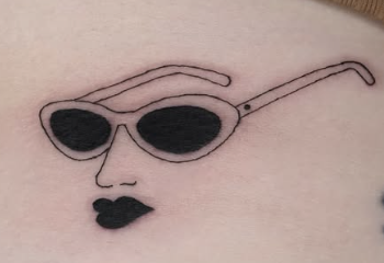 Linework tattoo of sunglasses with lips