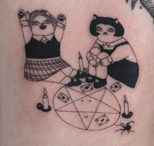 Linework tattoo of two cat-girls around a candle circle