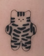 Linework tattoo of a small striped plush cat