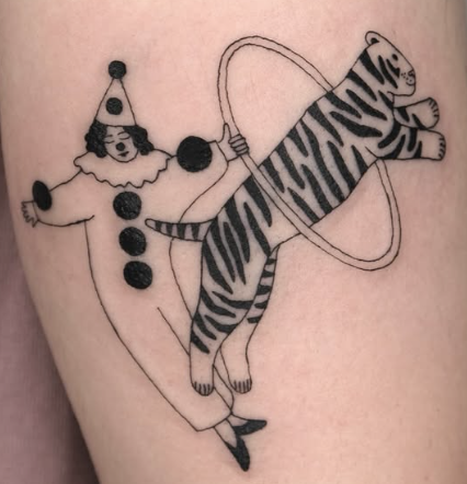 Linework tattoo of a clown holding a striped cat with a hoop