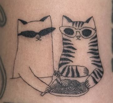Linework tattoo of two cats knitting