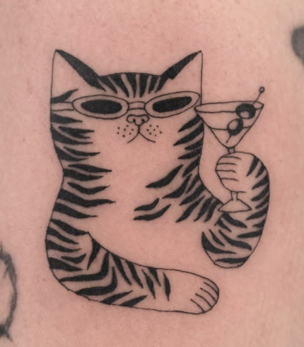 Linework tattoo of a striped cat in sunglasses holding a martini