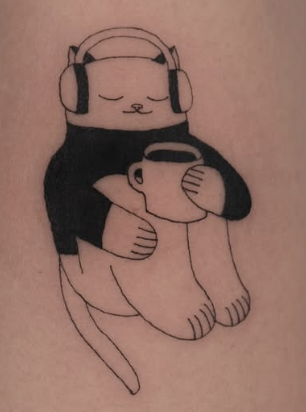 Linework tattoo of a cat wearing headphones hugging a cup