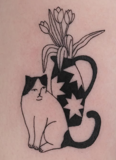 Linework tattoo of a cat beside a patterned vase of tulips