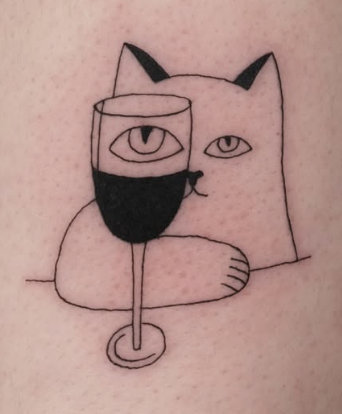 Linework tattoo of a cat behind a wine glass
