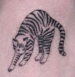 Shading tattoo of a crouching striped cat