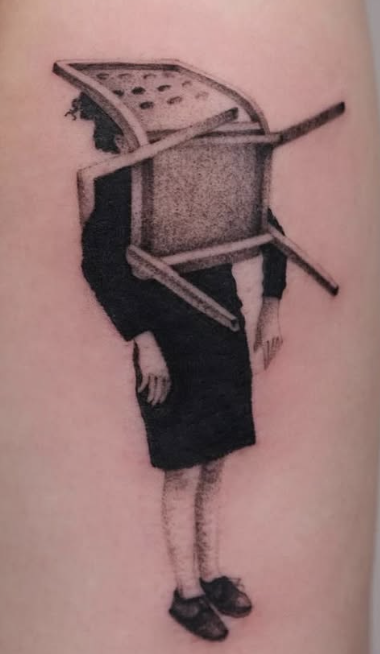 Shaded tattoo of a figure with a chair over their head
